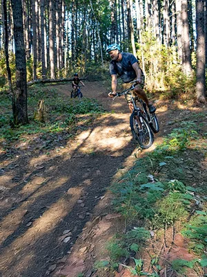 A man and his son bike down the trails in Nestor Falls